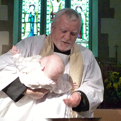 Father John Baptising